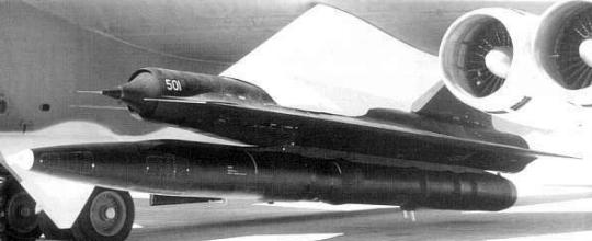 D-21B with booster rocket on pylon under B-52H